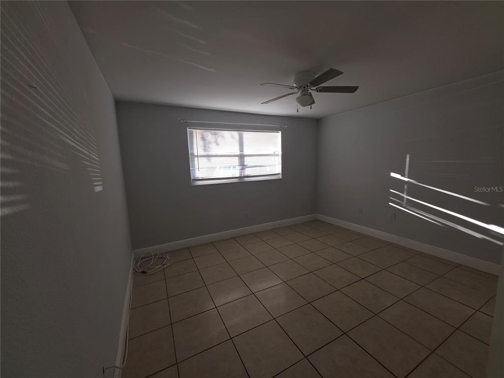 1344 Wickham Lane Holiday, FL 34691 - Photo 6 of 17 an empty room with windows