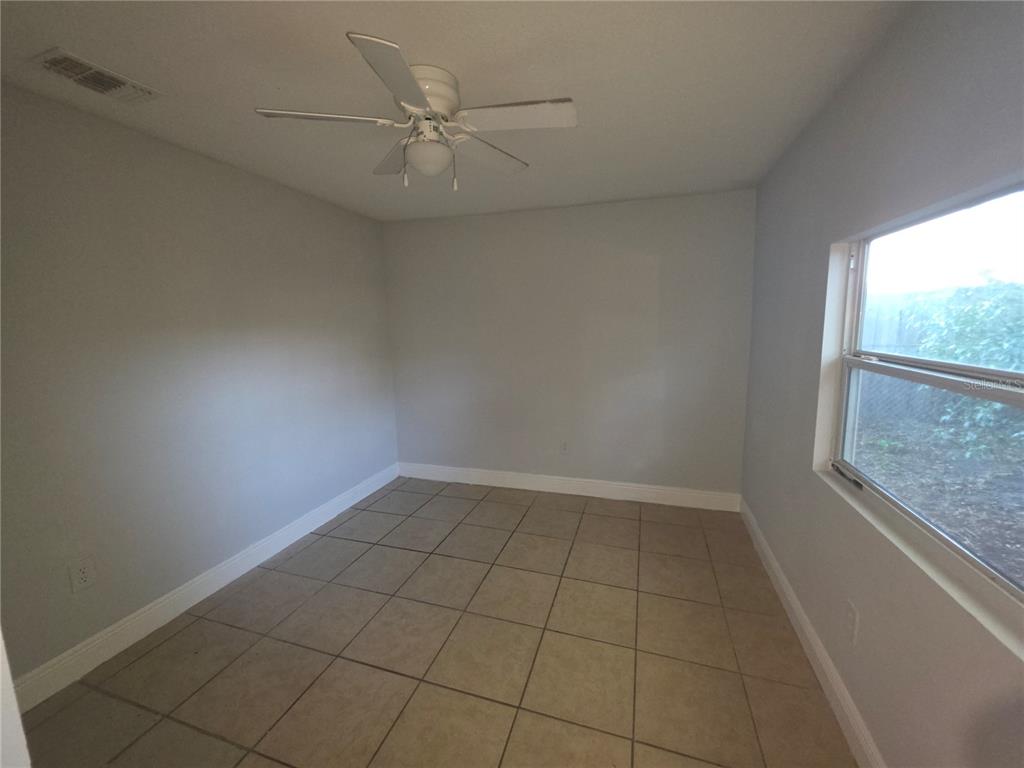 1344 Wickham Lane Holiday, FL 34691 - Photo 10 of 17 an empty room with a window