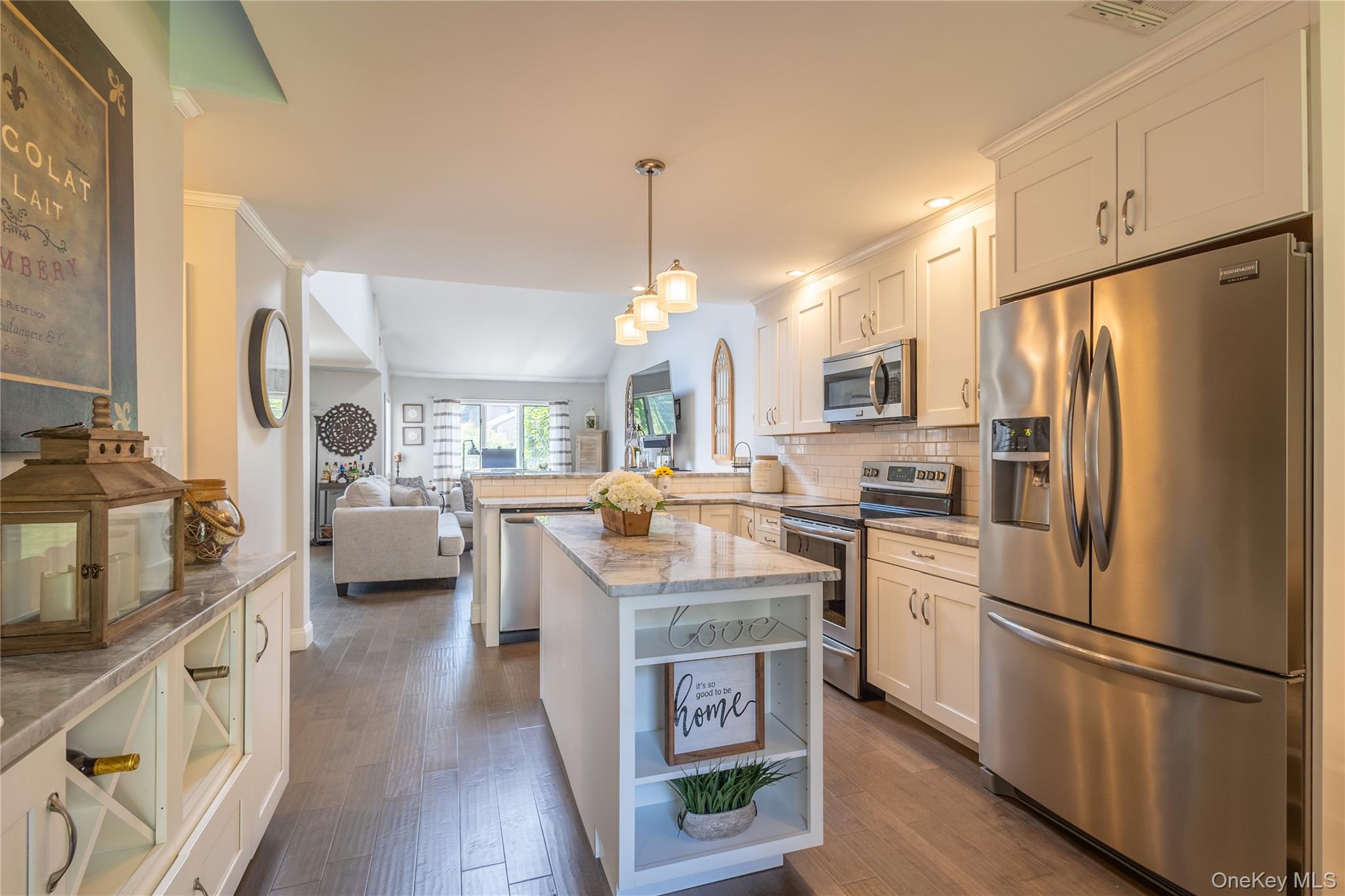 a kitchen with cabinets and stainless steel appliances