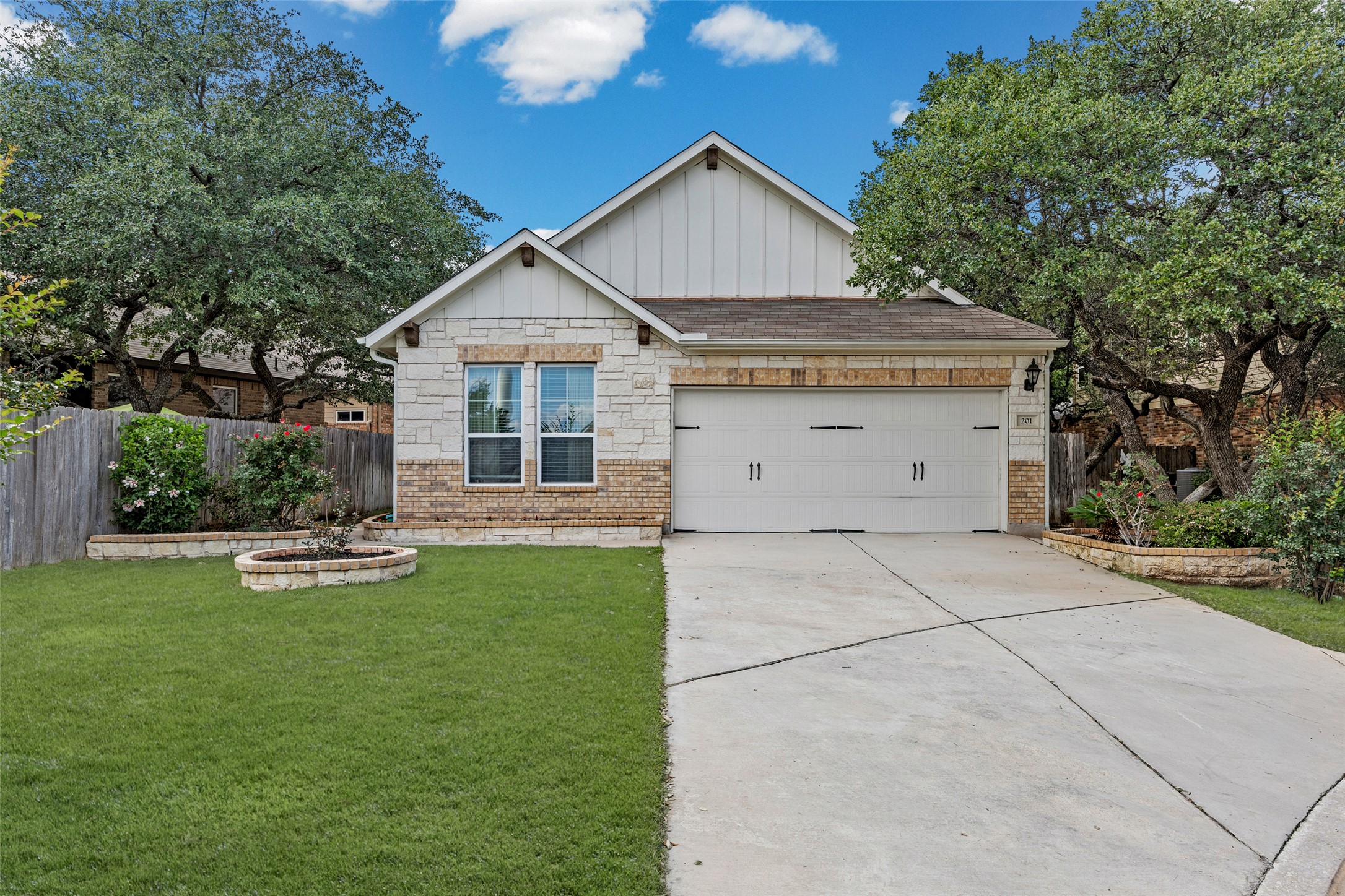 3451 Mayfield Ranch Boulevard, Unit 201 Round Rock, TX 78681 - Photo 1 of 29 a view of a house with backyard and garden
