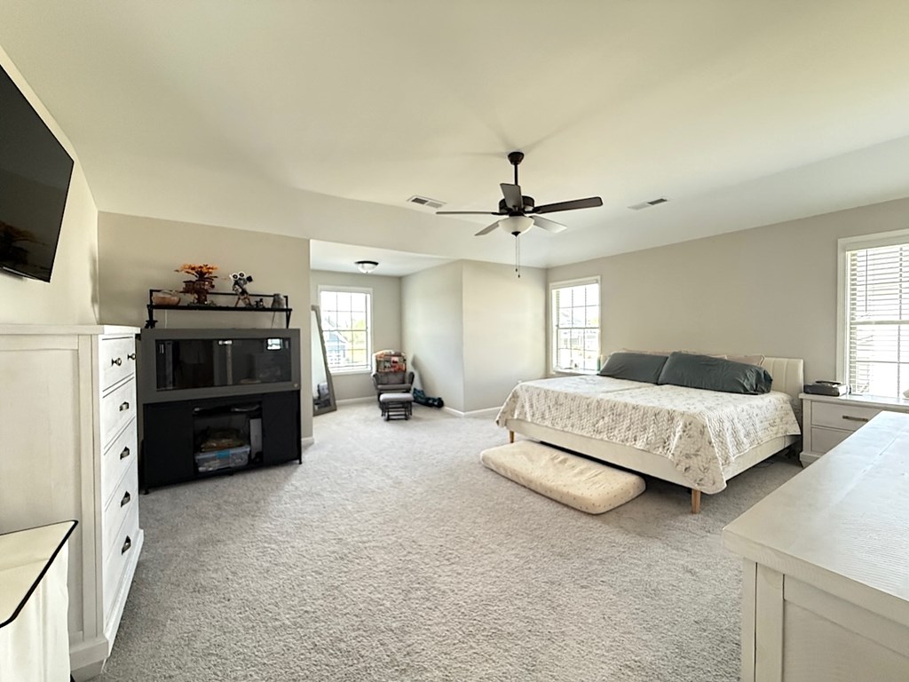 33 Sugar Maple Drive Fort Mitchell, AL 36856 - Photo 17 of 29 a spacious bedroom with a bed and a flat screen tv