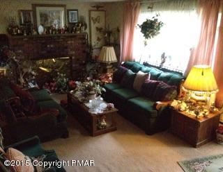 136 Pipher Road Bushkill, PA 18324 - Photo 4 of 12 Living Room with Brick fireplace