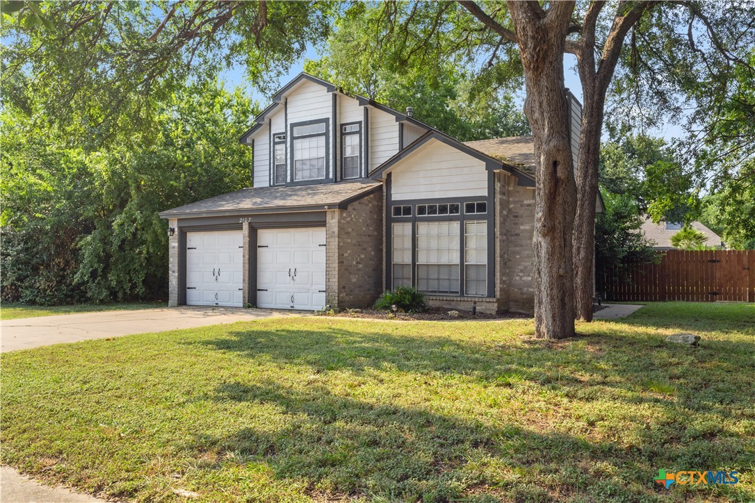 2107 Raintree Path Round Rock, TX 78664 - Photo 1 of 35 a view of a house with yard and tree s