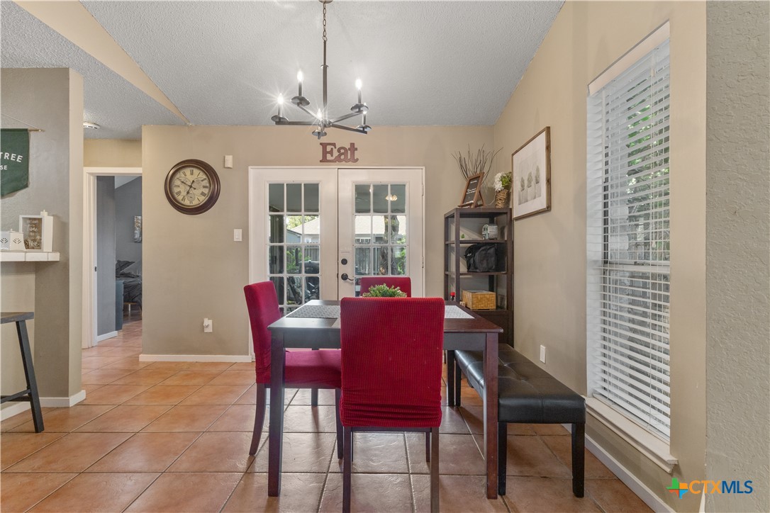 2107 Raintree Path Round Rock, TX 78664 - Photo 12 of 35 a view of a dining room with furniture window and wooden floor