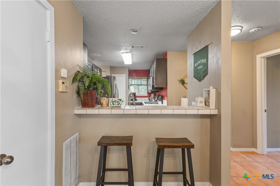 2107 Raintree Path Round Rock, TX 78664 - Photo 14 of 35 a dining room with table and chairs