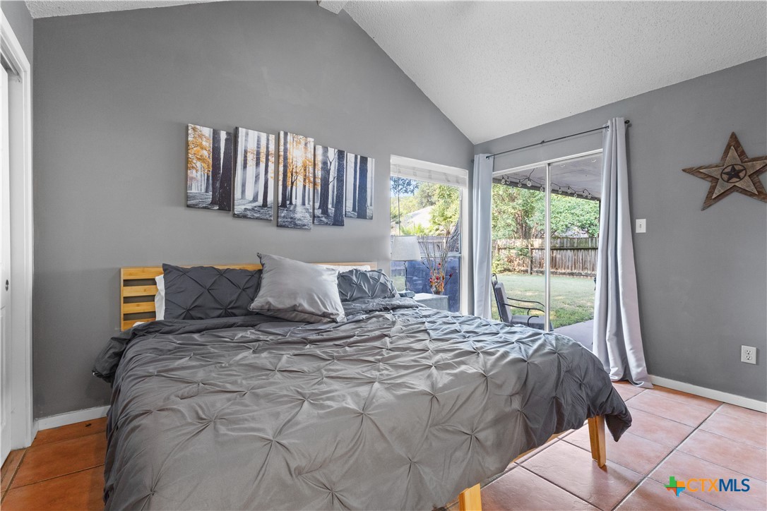 2107 Raintree Path Round Rock, TX 78664 - Photo 21 of 35 a large bed sitting in a bedroom next to a window