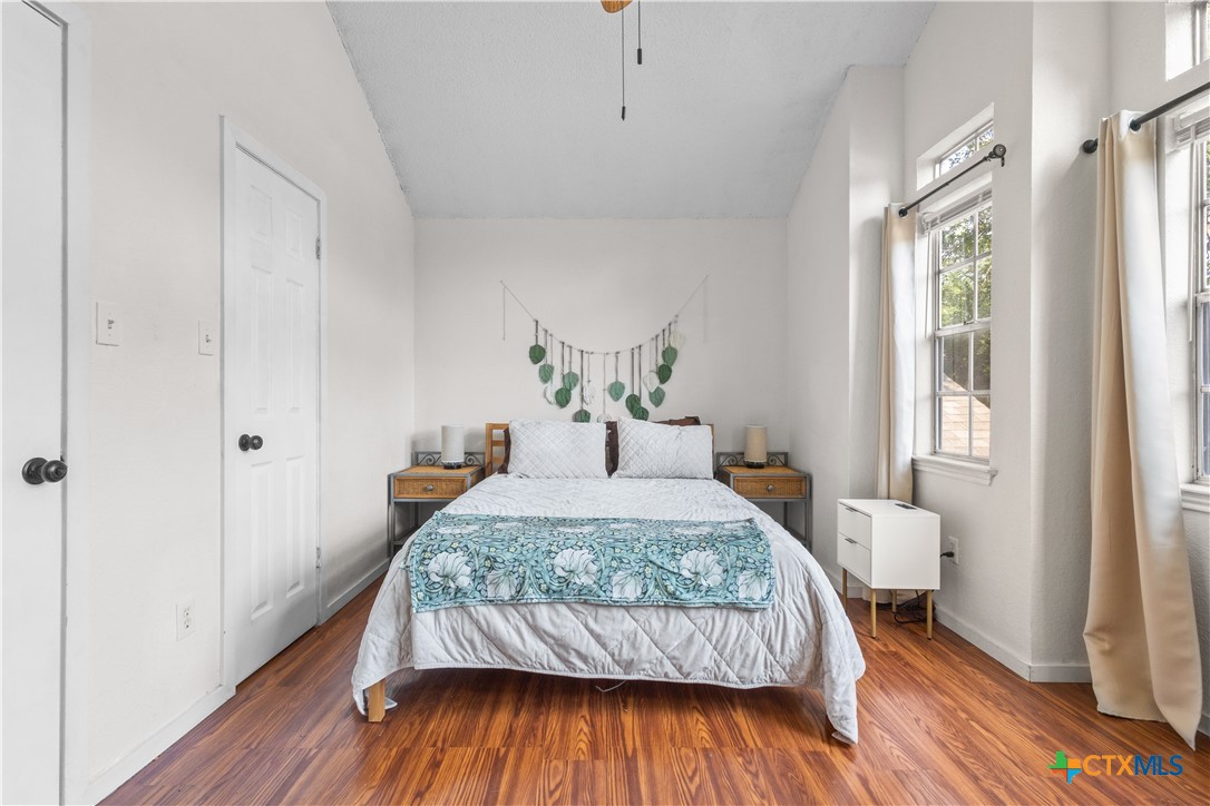 2107 Raintree Path Round Rock, TX 78664 - Photo 24 of 35 a bedroom with a bed and wooden floor