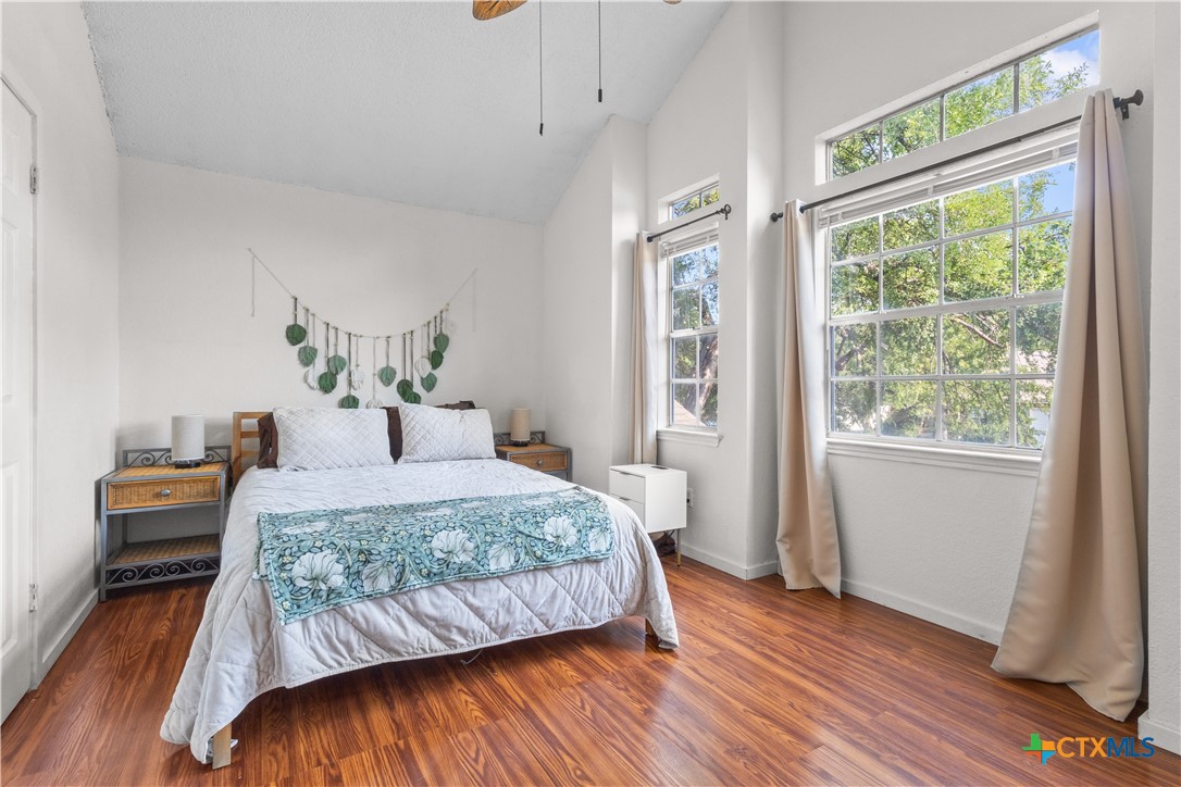 2107 Raintree Path Round Rock, TX 78664 - Photo 25 of 35 a bedroom with a bed and wooden floor
