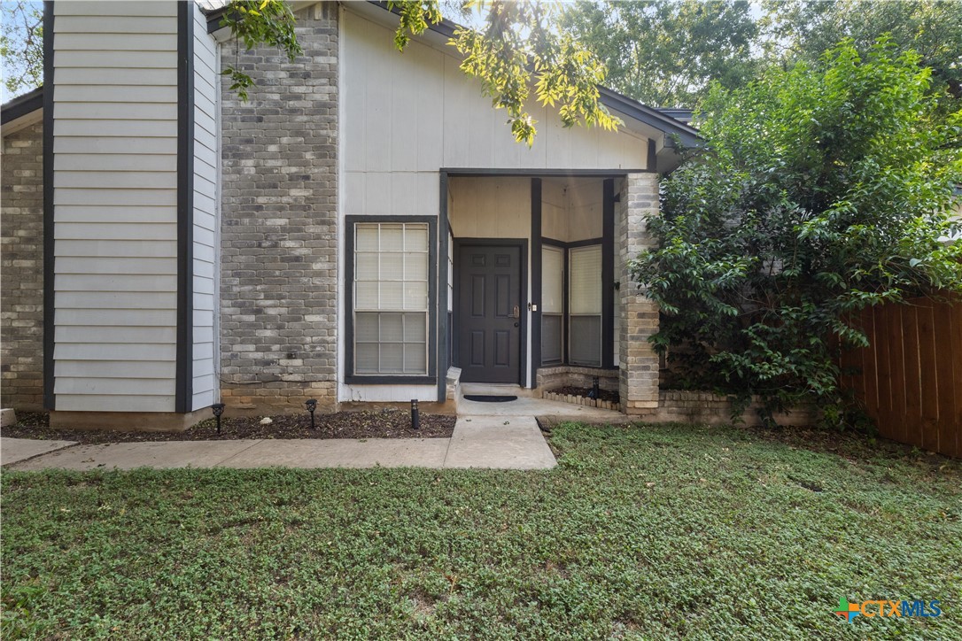 2107 Raintree Path Round Rock, TX 78664 - Photo 6 of 35 a front view of a house with garden