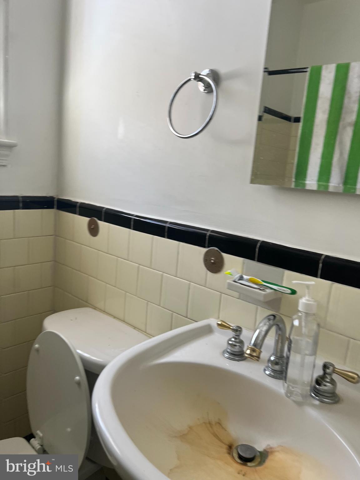 1601 Holbrook Street Northeast Washington, DC 20002 - Photo 15 of 21 a bathroom with a sink and mirror