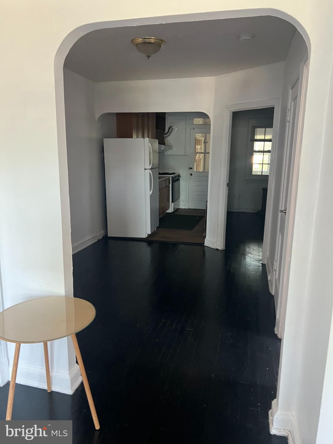 1601 Holbrook Street Northeast Washington, DC 20002 - Photo 5 of 21 a view of a hallway with wooden floor and a cabinet