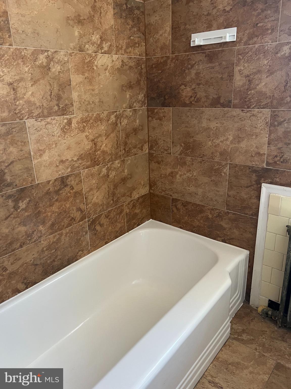 1601 Holbrook Street Northeast Washington, DC 20002 - Photo 7 of 21 a bathroom with a bathtub