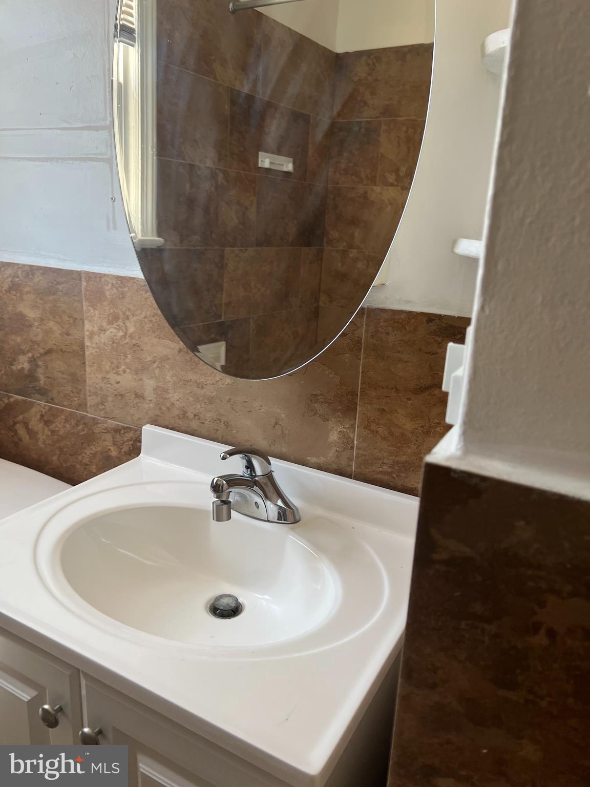 1601 Holbrook Street Northeast Washington, DC 20002 - Photo 8 of 21 a bathroom with a sink and a mirror