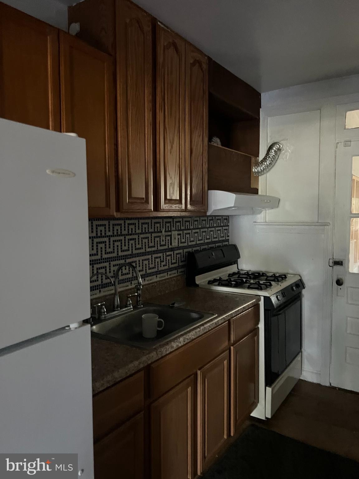 1601 Holbrook Street Northeast Washington, DC 20002 - Photo 9 of 21 a kitchen with a stove and a refrigerator