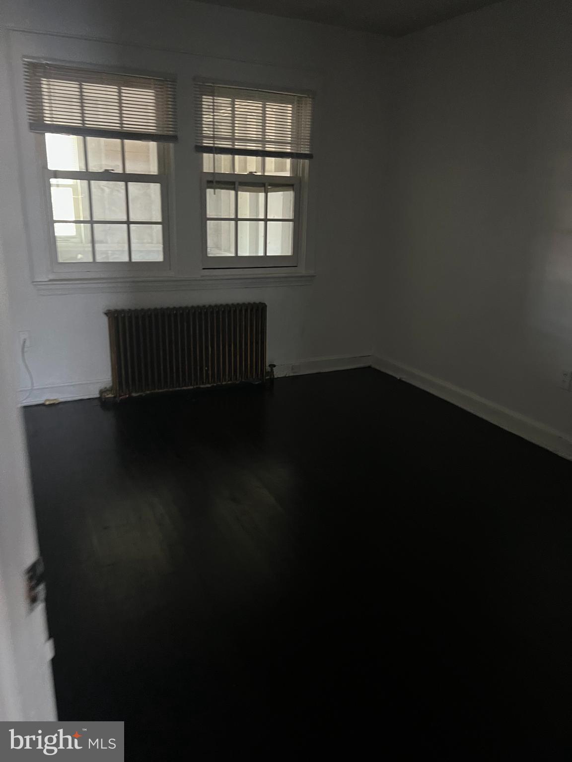1601 Holbrook Street Northeast Washington, DC 20002 - Photo 10 of 21 an empty room with wooden floor and windows