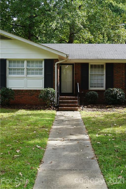 10437 White Pine Road Charlotte, NC 28215 - Photo 4 of 39 a front view of a house with a yard