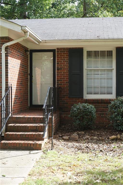 10437 White Pine Road Charlotte, NC 28215 - Photo 5 of 39 a front view of a house with a yard