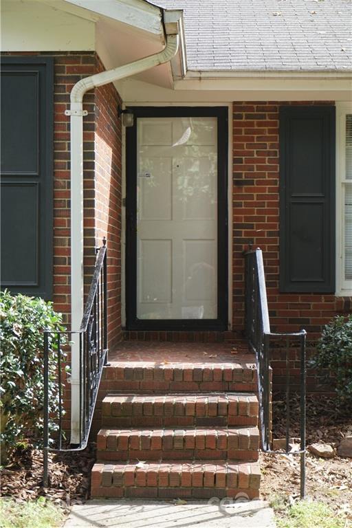 10437 White Pine Road Charlotte, NC 28215 - Photo 6 of 39 a front view of a house with stairs