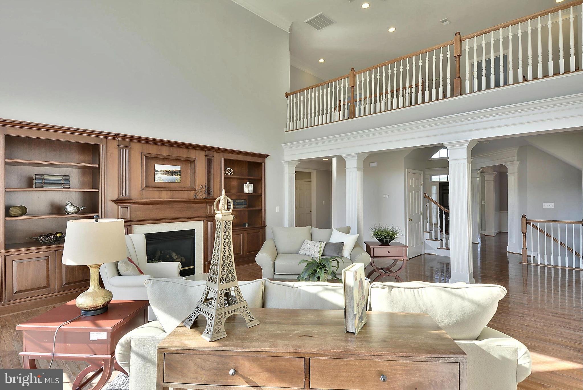 15429 Maple Ridge Drive Woodbine, MD 21797 - Photo 11 of 30 a living room with fireplace furniture and a wooden floor