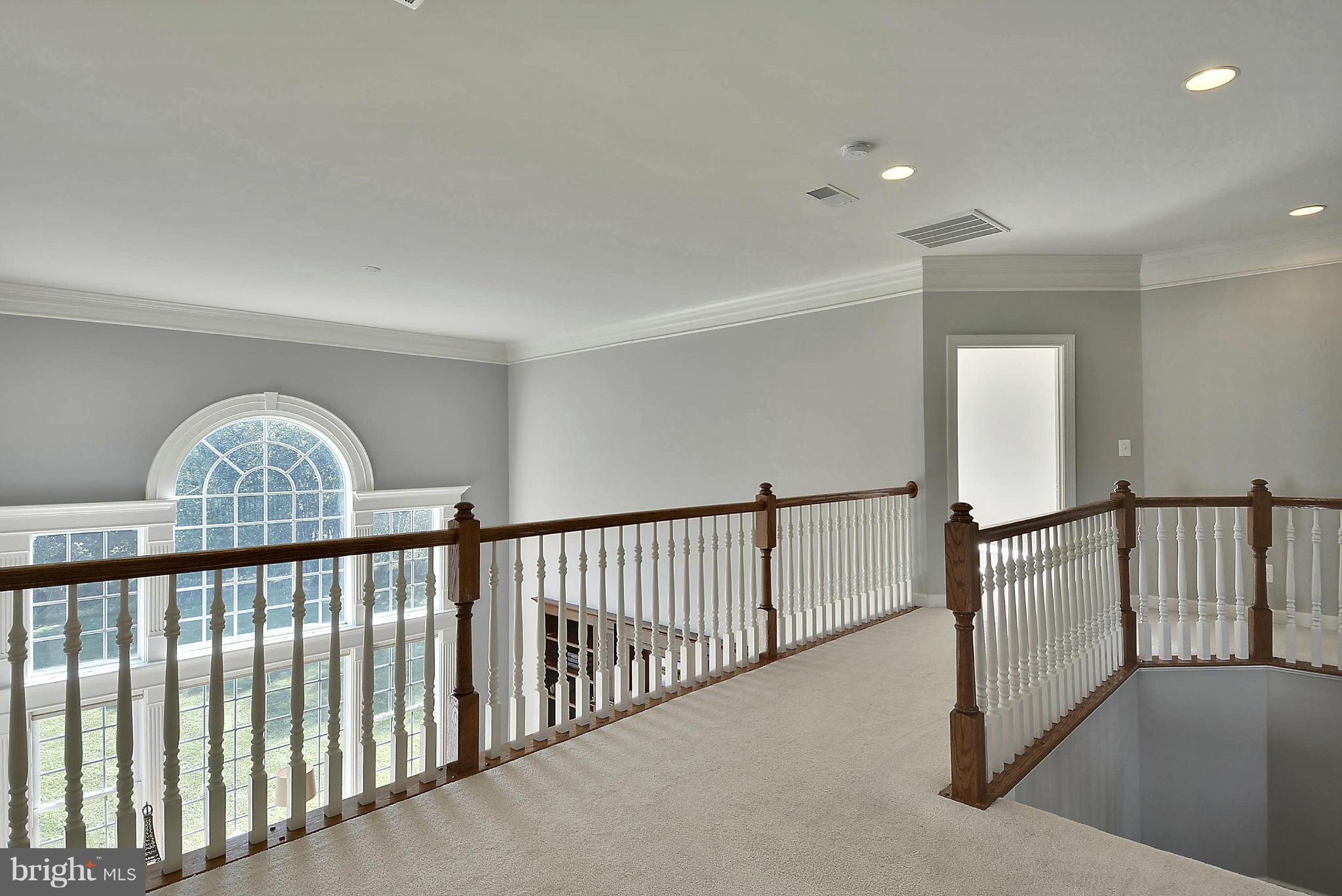 15429 Maple Ridge Drive Woodbine, MD 21797 - Photo 19 of 30 a view of staircase with flat screen tv