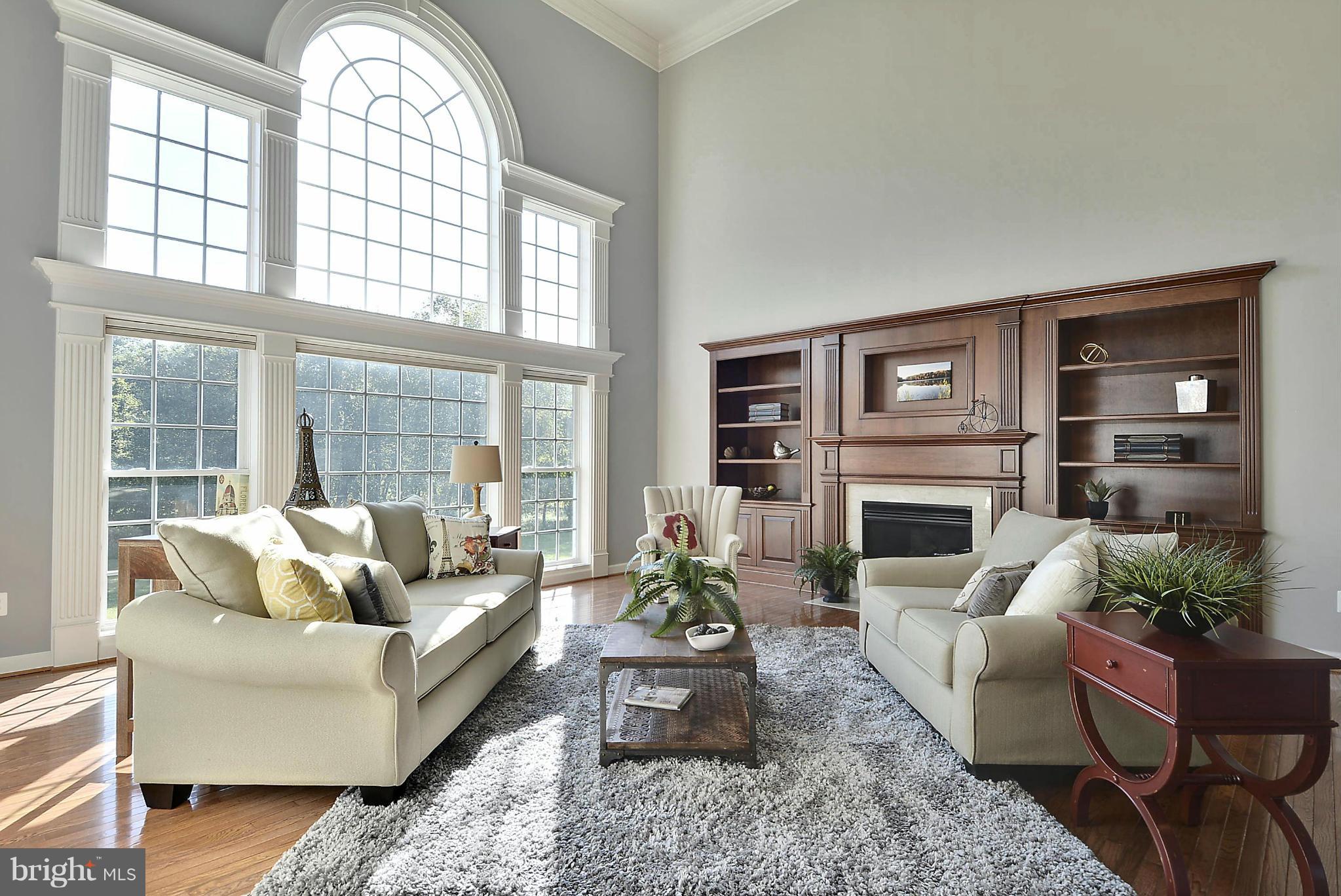 15429 Maple Ridge Drive Woodbine, MD 21797 - Photo 4 of 30 a living room with furniture fireplace and a large window
