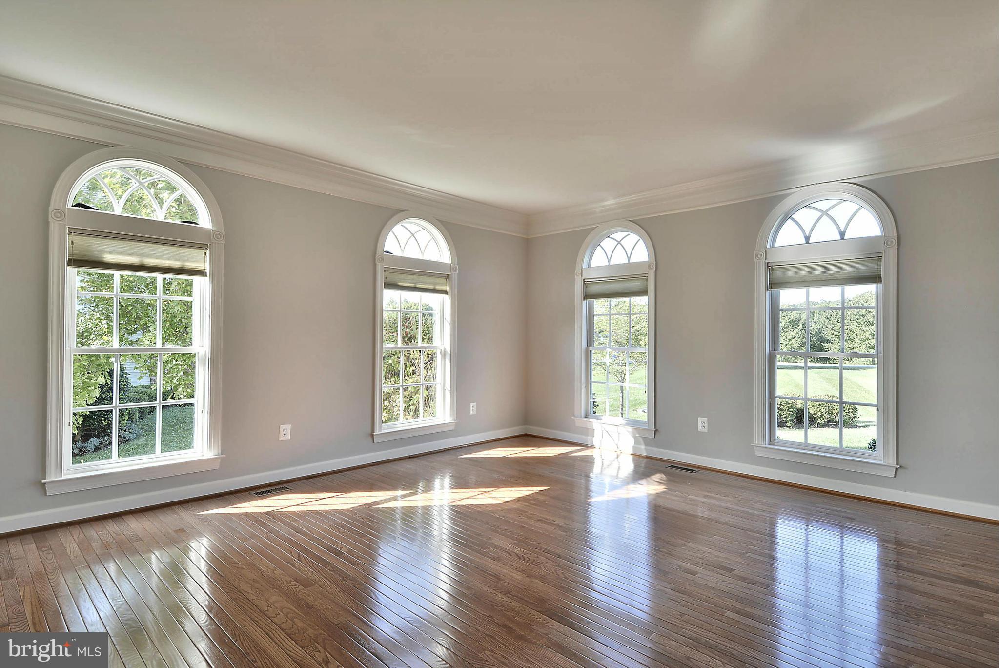 15429 Maple Ridge Drive Woodbine, MD 21797 - Photo 9 of 30 a view of an empty room with wooden floor and a window