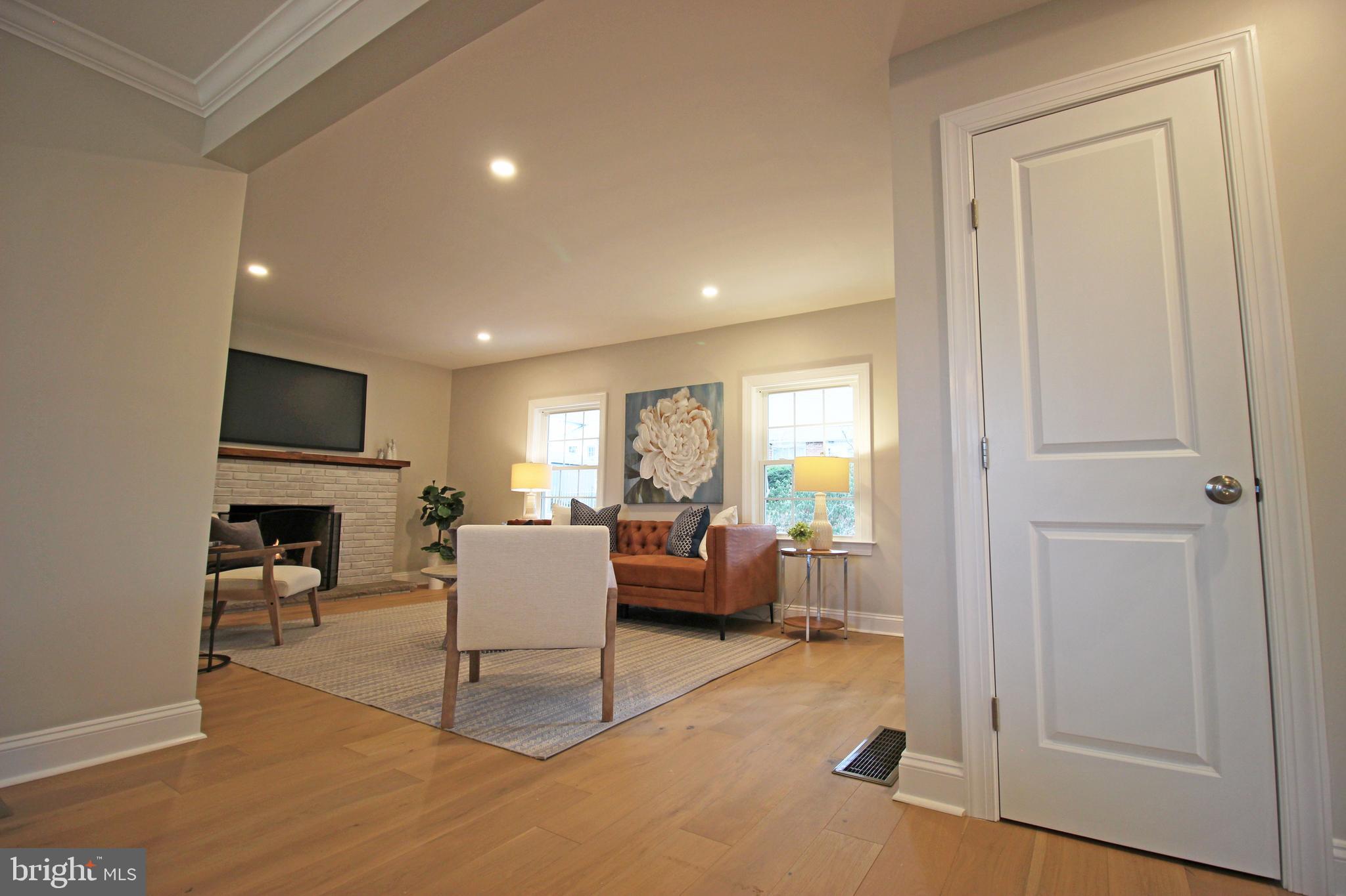 949 West Avenue Springfield, PA 19064 - Photo 20 of 42 a living room with furniture a flat screen tv and a window