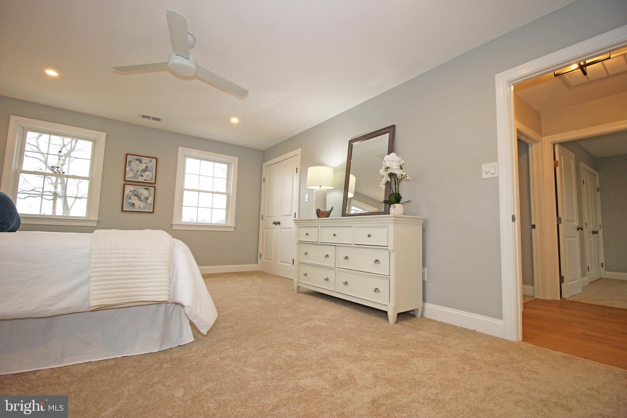 949 West Avenue Springfield, PA 19064 - Photo 30 of 42 a spacious bedroom with a bed and a dresser