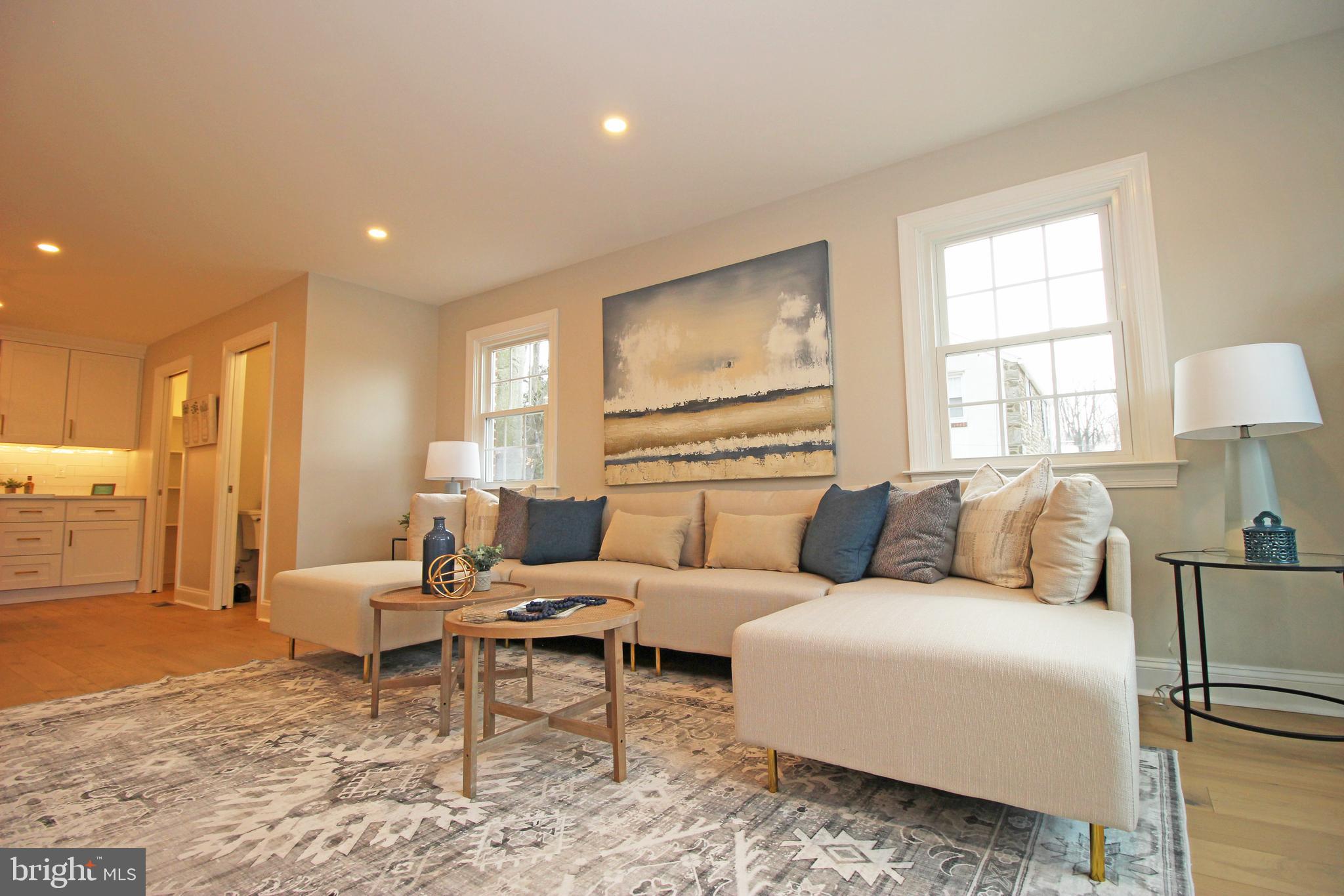949 West Avenue Springfield, PA 19064 - Photo 7 of 42 a living room with furniture and a large window