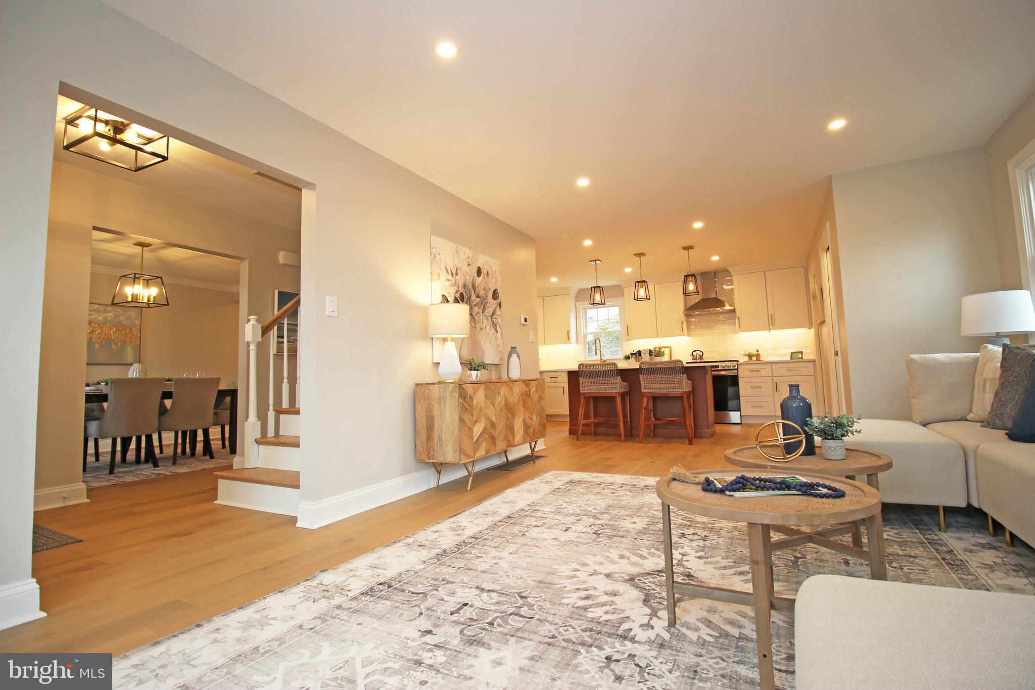 949 West Avenue Springfield, PA 19064 - Photo 8 of 42 a living room with lots of furniture and kitchen view