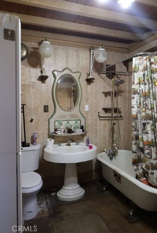 a room with gym equipment and a chandelier