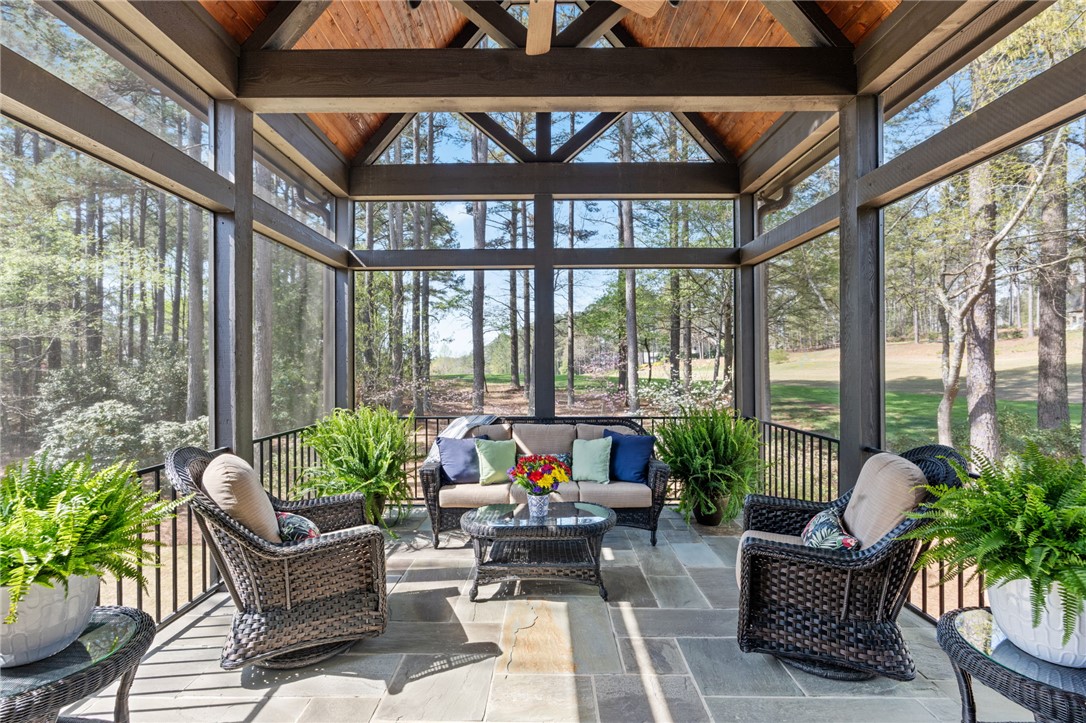 418 Augusta Way Sunset, SC 29685 - Photo 12 of 50 This screened porch provides a serene outdoor retreat with captivating views of the golf course.