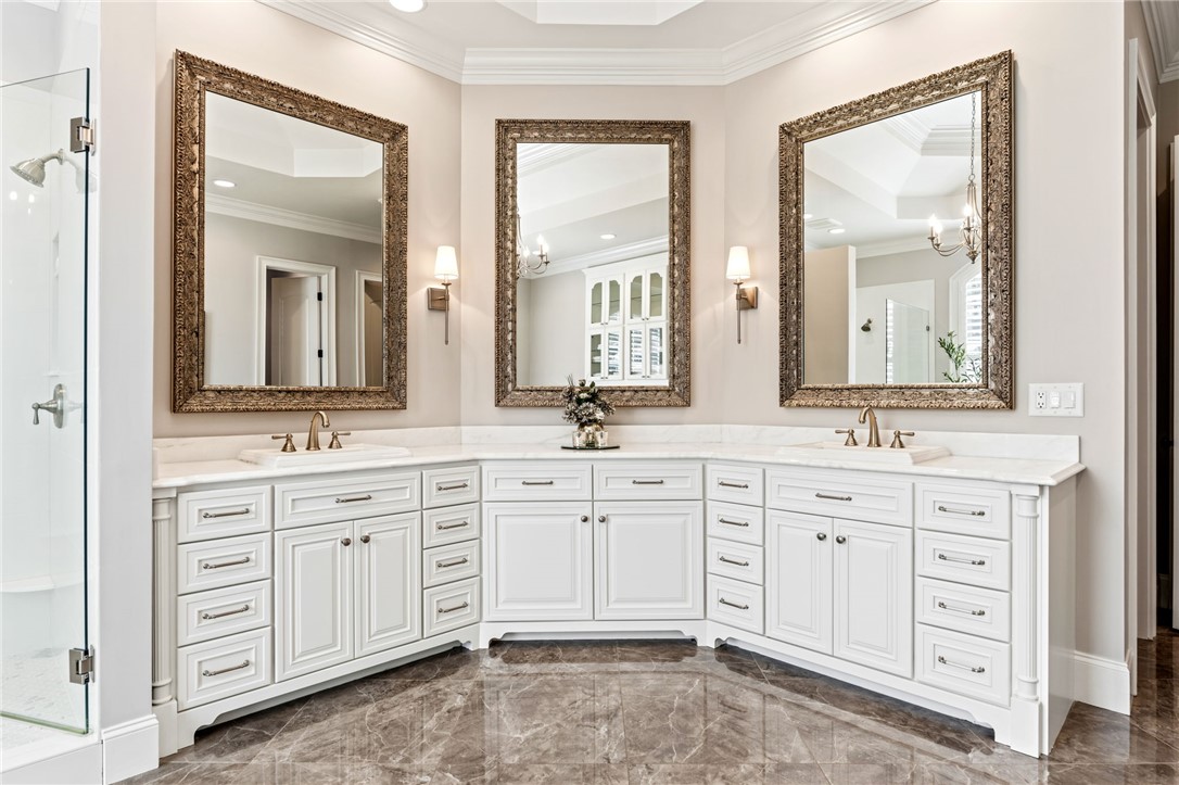 418 Augusta Way Sunset, SC 29685 - Photo 15 of 50 This spacious bathroom boasts a grand dual vanity with elegant cabinetry and a luxurious shower.
