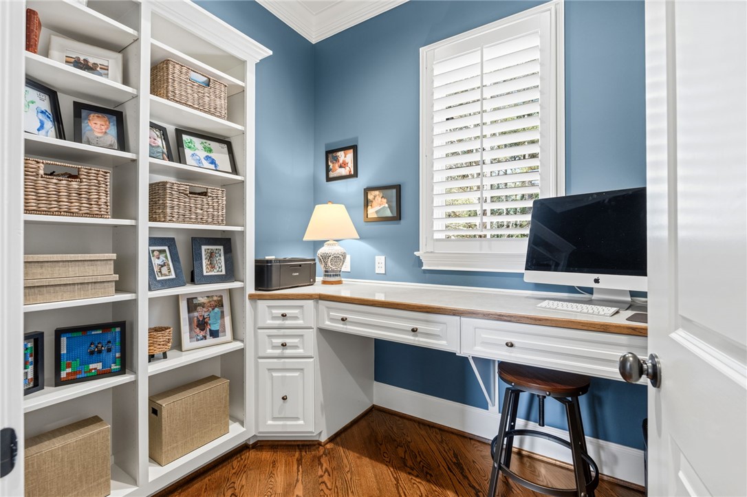 418 Augusta Way Sunset, SC 29685 - Photo 17 of 50 A well-appointed home office with built-in shelving offers a serene and productive environment.
