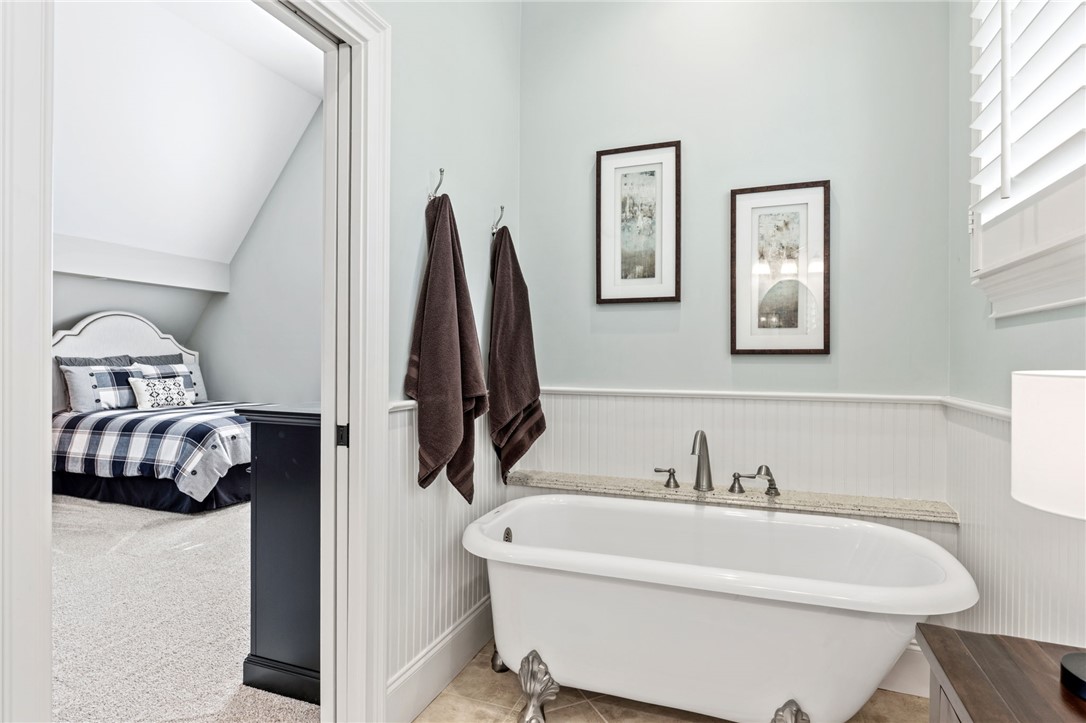 418 Augusta Way Sunset, SC 29685 - Photo 27 of 50 This tranquil bathroom features a clawfoot tub, offering a serene retreat adjacent to a cozy bedroom.
