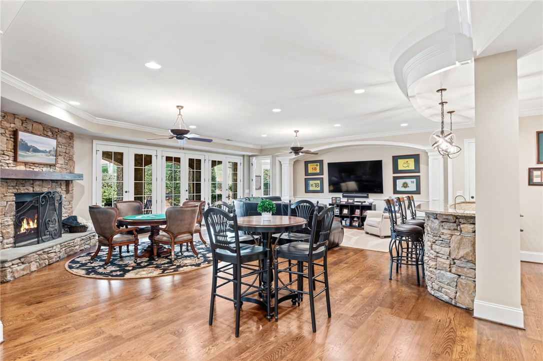 418 Augusta Way Sunset, SC 29685 - Photo 28 of 50 This expansive room offers a fireplace, multiple French doors, and a stone-clad wet bar for grand entertaining.