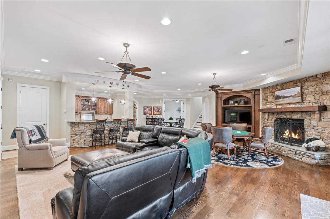 418 Augusta Way Sunset, SC 29685 - Photo 33 of 50 An inviting family room, complete with a bar and fireplace, offers abundant space for recreation.