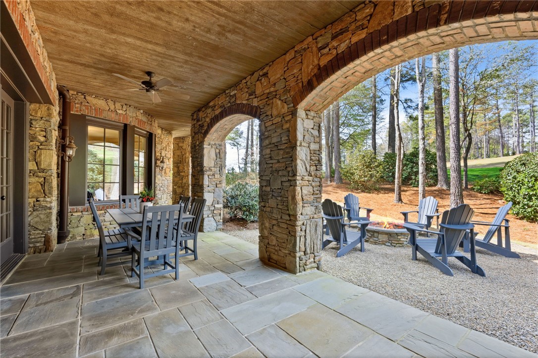 418 Augusta Way Sunset, SC 29685 - Photo 37 of 50 An inviting stone patio offers an ideal setting for outdoor entertaining and relaxation.