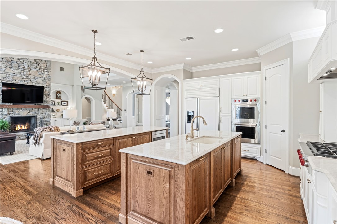 418 Augusta Way Sunset, SC 29685 - Photo 9 of 50 This spacious kitchen with double islands flows seamlessly into the inviting living area.