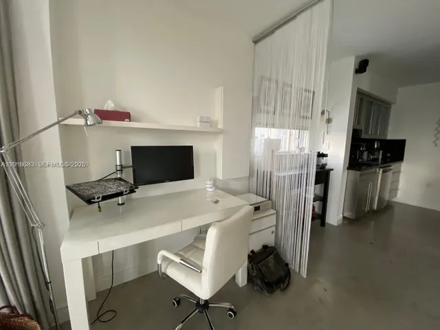 a room with furniture a washer and dryer