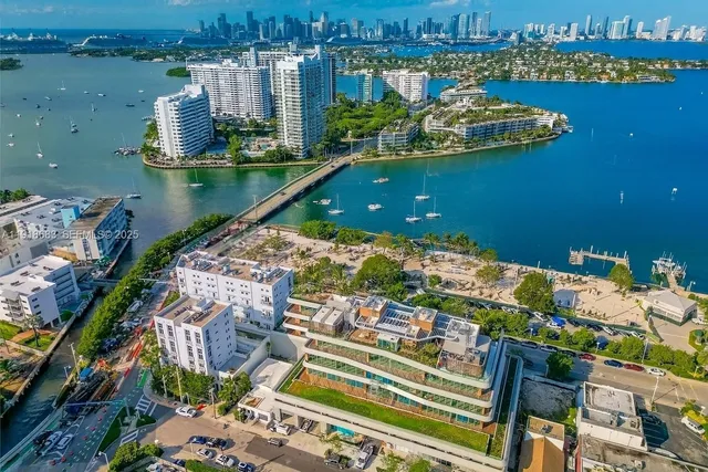 an aerial view of a house with a lake view