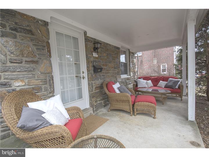 17 Braeburn Road Havertown, PA 19083 - Photo 2 of 25 a outdoor living space with furniture and a potted plant
