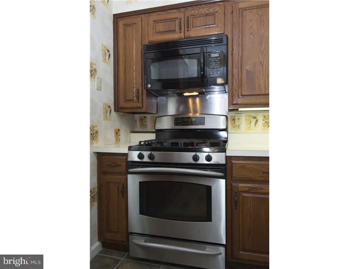 17 Braeburn Road Havertown, PA 19083 - Photo 12 of 25 a kitchen with a stove and a microwave