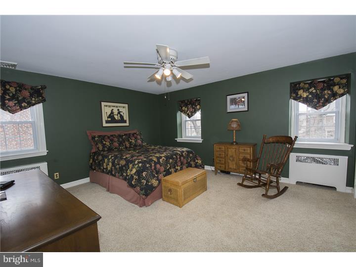 17 Braeburn Road Havertown, PA 19083 - Photo 15 of 25 a bed room with a bed mirror and a window
