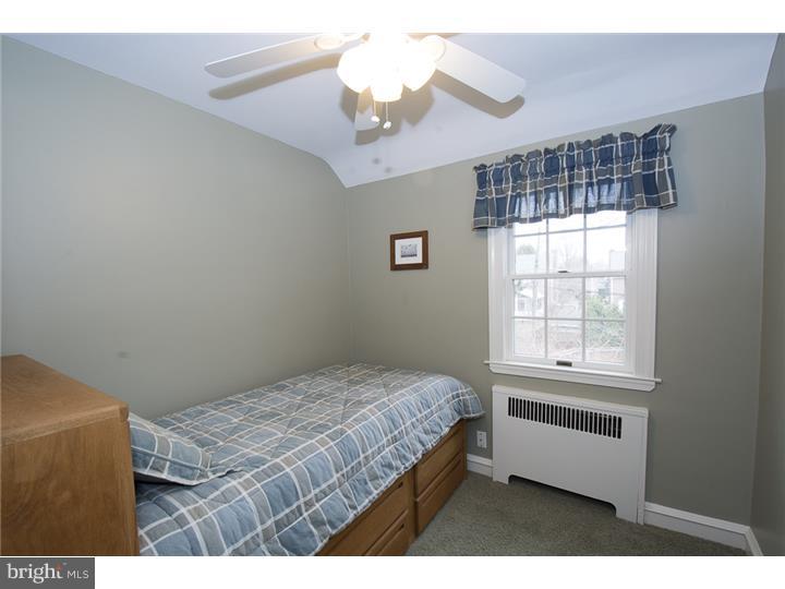 17 Braeburn Road Havertown, PA 19083 - Photo 19 of 25 a bedroom with a bed and a window