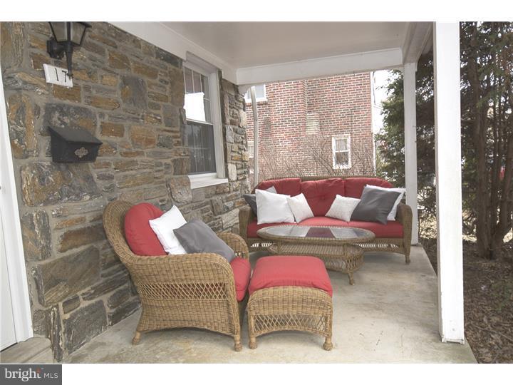 17 Braeburn Road Havertown, PA 19083 - Photo 3 of 25 a living room with furniture and a floor to ceiling window