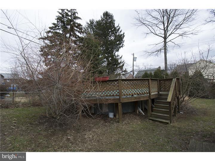 17 Braeburn Road Havertown, PA 19083 - Photo 23 of 25 a backyard of a house with table and chairs