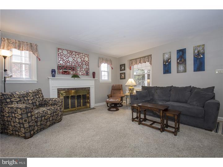 17 Braeburn Road Havertown, PA 19083 - Photo 5 of 25 a living room with furniture and a fireplace