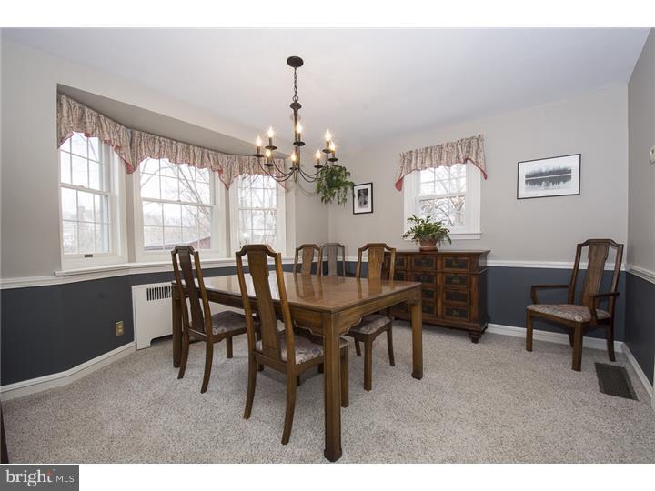 17 Braeburn Road Havertown, PA 19083 - Photo 8 of 25 a dining room with furniture a chandelier and wooden floor