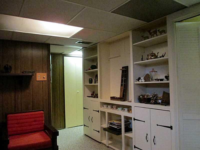 313 Edgewood Road Forest Hills, PA 15221 - Photo 14 of 18 Exterior Front. Wall of bookshelves and cupboards in game room